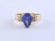 Pear shaped tanzanite and diamond ring set in 14k yellow gold